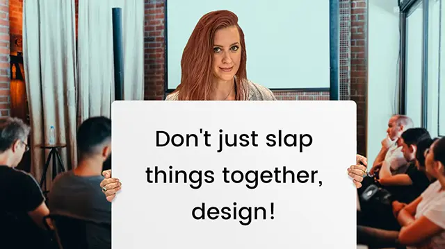 Female presenter holding a sign that says 'Don't just slap things together, design!' in front of an audience, highlighting the importance of effective online presentations.