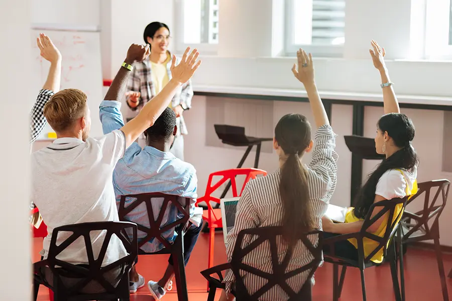 Students actively participating in a classroom presentation session, demonstrating student engagement, effective presentation skills, and classroom visuals.