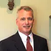 Man in a suit with a red tie, Profile photo of Terry Hodgson, Director of the Program Management Office.