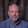 Profile photo of Wade Owens, a man with a beard wearing a blue shirt.