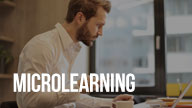 Microlearning course thumbnail with a man working on a laptop at a desk